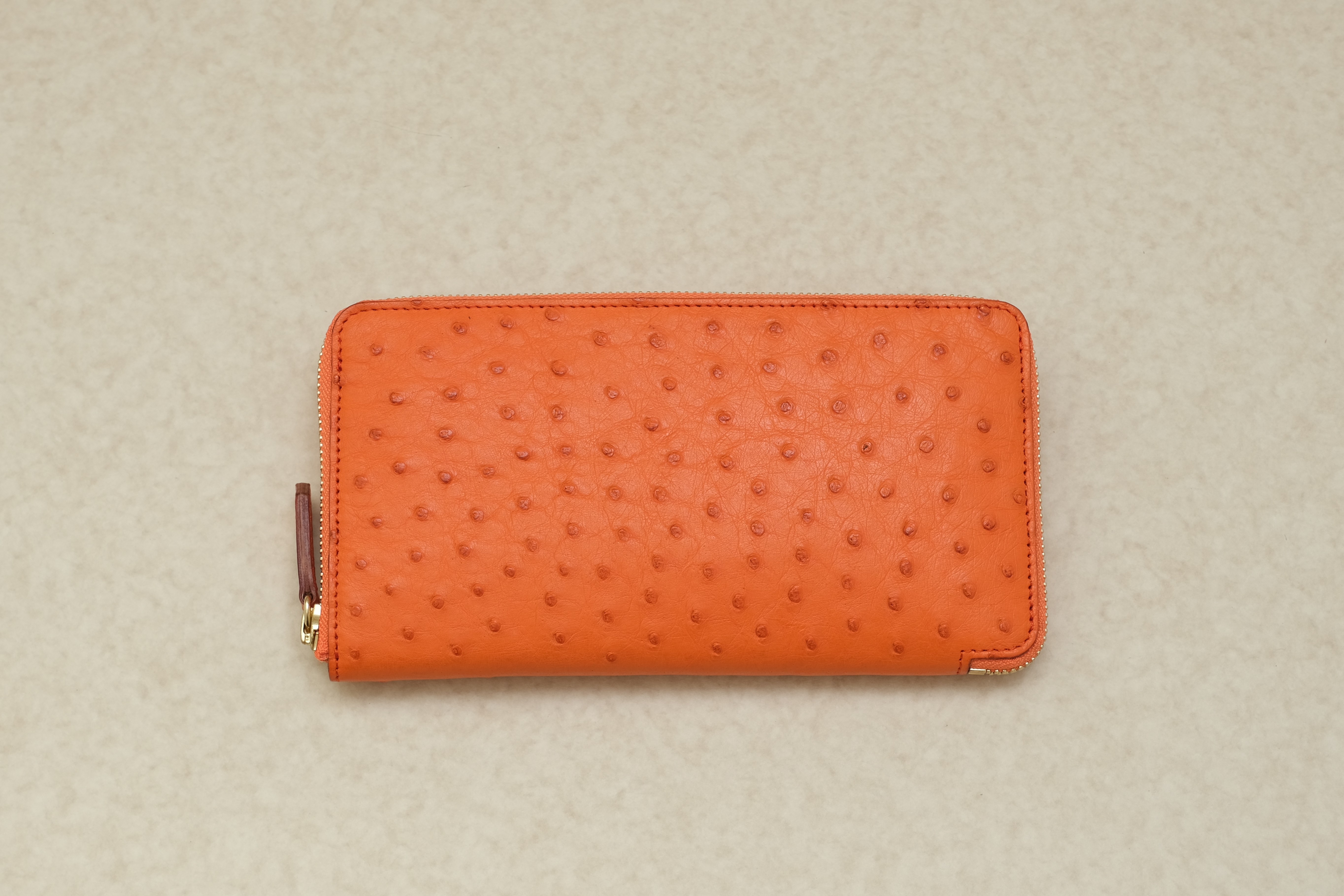 オレンジオーストリッチのファスナー長財布